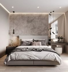 a large bed sitting in the middle of a bedroom next to a wall mounted mirror