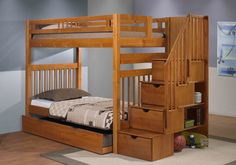 a bunk bed with drawers underneath it and stairs to the upper level in a bedroom