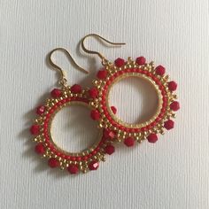 Red Crystal Seed Bead Hoop Earringsp Hoop earrings made with bright red velvety crystals with metallic gold 11/0 beads. The perfect Christmas holiday season earrings. Beautiful red crystals bead woven on a gold plated ring. The french hook earwires and findings are 14kt gold plated. These very lightweight measure 1.75 inches total. The beaded hoops are slightly over 1 inch. Great for anytime. I absolutely love this color and sparkle. Thanks for looking and please stop by again. 8 Red Beaded Earrings For Holiday, Red Beaded Earrings For Holiday With Round Beads, Red Faceted Beads Earrings For Festive Occasions, Handmade Red Beaded Hoop Earrings, Elegant Red Hoop Earrings, Christmas Gold Beaded Earrings, Elegant Red Beaded Hoop Earrings, Festive Red Hoop Earrings For Pierced Ears, Red Round Beaded Earrings For Festive Occasions