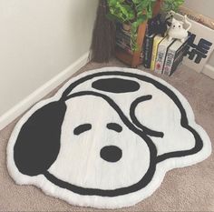 a rug with a dog's head on it in the corner of a room