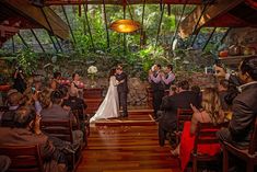 a bride and groom standing at the end of their wedding ceremony