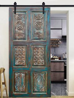 an old wooden door with decorative designs on the front and side panels is shown in this room