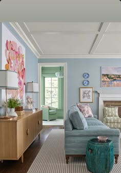 a living room with blue walls and furniture