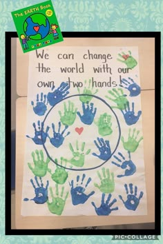 a handprinted poster that says we can change the world with our own two hands