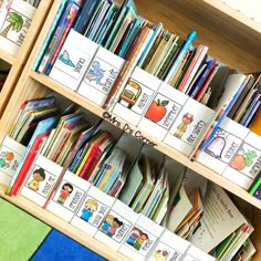 a book shelf filled with lots of children's books on top of each other