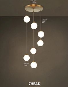 an image of a chandelier that has seven balls hanging from it and measurements