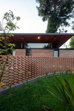 a brick house with a roof made of bricks