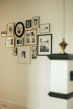 a white wall with many pictures on it