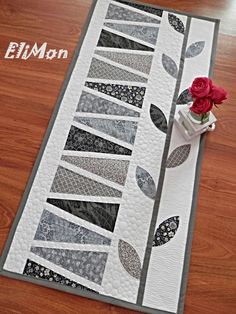 a table runner with flowers on top of it