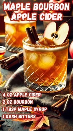 an apple cider with cinnamon and apples on the side, surrounded by fall leaves