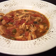 a white bowl filled with soup on top of a table