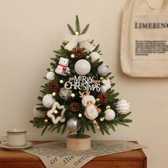 a small christmas tree on top of a wooden table