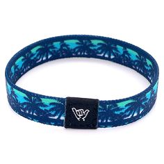 "Dream of your favorite island escape over and over with our Deja Blu band. Available sizes: Extra Small 5.5\" Small 6.5\" Medium 7.5\" Anklet 9\" 3/8\" Width Reversible surf, music and beachy prints. Elastic blend material, can stretch to desired fit. Packaged in natural drawstring gift pouches. Machine washable. Chlorine and saltwater safe." Cheap Blue Bracelets For Beach, Cheap Blue Beach Bracelets, Cheap Blue Beachy Bracelets, Blue Hypoallergenic Bracelets For Beach, Playful Blue Bracelets For Beach, Loose Bracelet, Beachy Prints, Beachy Bracelets, Surf Music