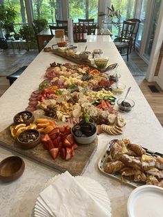 a long table with many different foods on it