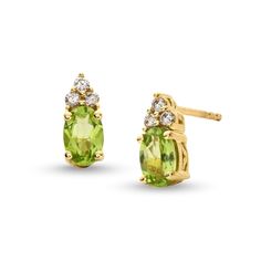 Make their August birthday a magical one with these stunning peridot and diamond stud earrings. 10K gold Each earring features a 6.0 x 4 oval-shaped spring-green peridot center stone Trios of diamonds top each center stone 1/10 ct. t.w. of diamonds Post earrings; friction backs Diamond Top, August Birthday, Diamond Stud Earrings, Green Peridot, Diamond Stud, Spring Green, Diamond Earrings Studs, 10k Gold, Diamond Studs