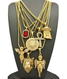 Hip Hop Ruby, 2 Angels, Jesus, Lion, Medusa, Ankh Pendant 7 Necklace Set RC1835G Brand New  7 PCS Necklace Set Hip Hop Celebrity Style Pendant & Chain Ruby-0.6" & 1.15" 2mm 24" Box Chain Jesus-0.9" & 1.65" 4mm 24" Cuban Chain  Medusa-1.15" & 1.75" 3mm 24" Concave Cuban Chain  Ankh- 0.85" & 1.85" 2mm 24" Rope Chain  Angel-1.45" & 1.4" 2mm 27" Snake Chain Lion-0.85" & 1.75" 3mm 30" Cuban Chain  Angel- 0.95" & 2.25" 2mm 30" Box Chain 14K GOLD PLATED Retail Price : $140 Payments: US Customers: Paypa Truck Jewelry, 2 Angels, Princess Cut Diamond Earrings, Ankh Pendant, Jewelry Design Inspiration, Gold Chains For Men, Jewelry Tags, Dope Jewelry, Popular Jewelry