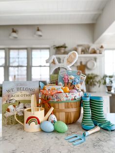 a basket filled with lots of different items on top of a counter next to a book