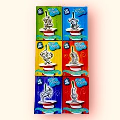 six boxes of different flavored teas on a white background, each with an image of a cat in the cup