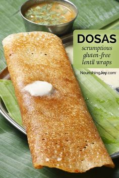 dosa served on a plate with dipping sauce