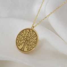 "Custom Family Name Necklace, Tree of Life Jewelry , Gift for Family, Wife, Grandma, Doughter, 14K Gold Personalized Family Necklace This necklace will be certainly GREAT GIFT for Christmas, Easter, Anniversary, Valentines Day, Mother`s day, Birthday, Engagement, Bridesmaid or Girlfriends. INFO ABOUT PRODUCT *Material: High Quality 925 Sterling Silver/14K Solid Gold. *Finish: Sterling Silver, 14K Gold-Plated, 14K Rose Gold-Plated and 14K Solid Gold, 14K White Gold, 14K Rose Gold. *Pendant diameter: 18 mm *Chain Size: 14\", 16\", 18\", 20\" and 22\". In addition, a 1\" extension chain is sent free of charge with the product. HOW TO ORDER 1. Select  Finish & Chain Lenght. 2. Add your personalization (Font Style, Text) in the Personalization Box. CARE TIPS *Store into a cool dry place. *Clean Necklace Tree, Life Jewelry, Tree Of Life Jewelry, Family Necklace, Tree Necklace, Personalized Pendant, Tree Of Life Necklace, Font Style, Gift For Family