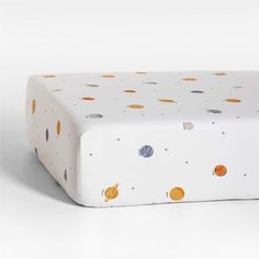 an image of a baby's crib mattress with planets on it