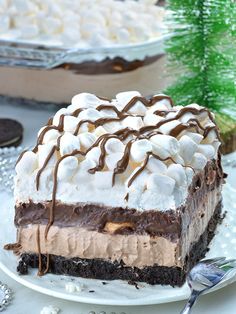 a piece of chocolate lasagna on a white plate with the words hot chocolate lasagna above it