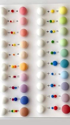 an array of different colored balls arranged on a white surface with numbers in the middle