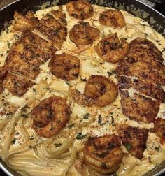 Homemade Cajun Chicken & Shrimp Alfredo: Tender chicken and succulent shrimp sautéed with Cajun spices, served over creamy Alfredo pasta. Perfect blend of spicy and creamy flavors! Cajun Chicken And Shrimp Alfredo, Cajun Chicken And Shrimp, Chicken And Shrimp Alfredo, Shrimp Alfredo Recipe, Plats Healthy, Shrimp Alfredo, Soul Food Dinner, Chicken And Shrimp, Alfredo Recipe