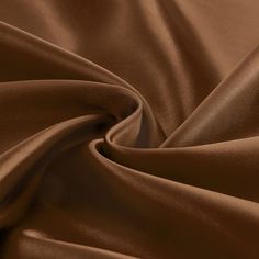 a close up view of a brown satin fabric with very high resolution and soft folds