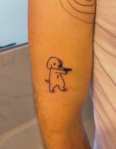 a man with a dog tattoo on his arm