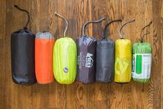 five different types of water bags hanging on the wall