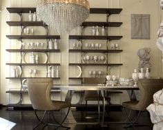 a dining room table with chairs and a chandelier