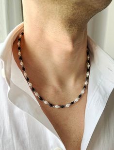 Mens Pearl Necklace with Black Onyx, Pearl Necklace Men, Real Pearl Necklace for Men, Gifts for Men, Birthday Gift for Him, y2k Jewelry, Mens Necklace, Freshwater Pearl Necklace, Necklace for Men, Black Onyx Necklace, Hematite Necklace ♥ Useful Quick Notes * This product is prepared with ivory freshwater pearls, black onyx stone crystals, dark gray shiny hematite stone beads and rhodium-plated ball beads. * The finish is made with a rhodium-plated lobster claw. * Length: We offer 2 options: 1. 50 cm - 19.7 inch.  2. 54 cm - 21.26 inch You may choose free chain extension (5 cm - 2 inch) The length may have difference up to 1 cm - 0.4 inch. * Made of high quality rhodium plated over brass.  * For longer lasting use, it is recommended to keep this handmade product away from chemicals, soap an Mens Pearl Necklace, Pearl Necklace Men, Gifts For Men Birthday, Real Pearl Necklace, Onyx Crystal, Hematite Necklace, Men Birthday, Y2k Jewelry, Black Onyx Necklace