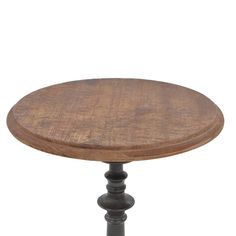 an old wooden table with black legs and a round top, on a white background