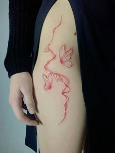 a woman's arm with a butterfly tattoo on the left side of her body