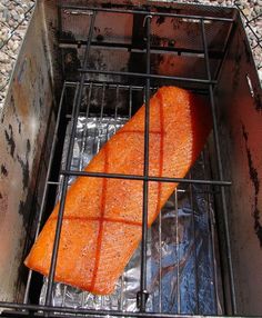 a piece of fish is cooking on the grill