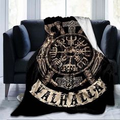 a black and gold blanket with an image of a large clock on the front that says ahana