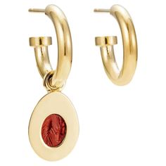 Victoria Strigini (b. 1991) A striking pair of contemporary 18k yellow gold hoop earrings, with a single charm featuring an ancient Roman intaglio from the 1st - 2nd century AD, in jasper. Two fish — the Pisces symbol — are gracefully incised in the deep red jasper intaglio, which is set in a striking, modern 18k gold egg-shaped amulet. The charm — which has bold, thick borders, emphasizing its modernist character — can be worn two ways: as a simple golden egg or flipped to reveal the intaglio. Symbolic Gold Intaglio Jewelry, Luxury Red Intaglio Jewelry, Ancient Intaglio Ring Jewelry, Luxury Carnelian Intaglio Jewelry, Vintage Coin-shaped Intaglio Jewelry, Gold For Sale, Red Jasper, Gold Hoop, Ancient Romans