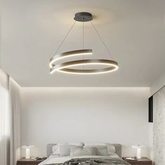 a bedroom with a large bed and round lights hanging from the ceiling