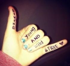 two fingers that have writing on them with the words young and wild written on them