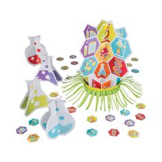 an assortment of paper toys including beaks, cups and magnets on a white background