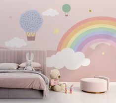 a child's bedroom decorated in pastel colors with rainbows and hot air balloons