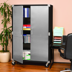 an office with a chair, desk and bookcase on the floor next to a potted plant