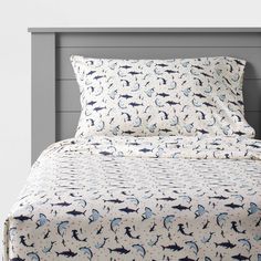 a bed with a blue and white pattern on it