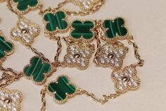 Indulge in the opulent elegance of our CLOVER 20 MOTIFS MALACHITE DIAMOND GOLD NECKLACE. Crafted with 20 stunning motifs adorned with malachite and diamonds, this necklace exudes luxury and sophistication. Elevate any outfit with this exclusive piece that embodies the beauty of art and fashion. ADDITIONAL INFORMATION Color: Gold Stone: Malachite, Cubic Zirconia Ref. vcarp34806 Material:- 925 Sterling Silver - 18k Gold Plated- 18k Real Gold ( contact us via instagram) Length of chain : 84cm Our r Designer Green Hallmarked Jewelry, Diamond Gold Necklace, Trinity Bracelet, Detailed Jewelry, Gold Diamond Necklace, Art And Fashion, Gold Stone, Diamond Gold, Love Bracelets