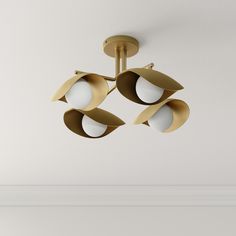 three lights hanging from the ceiling in a room