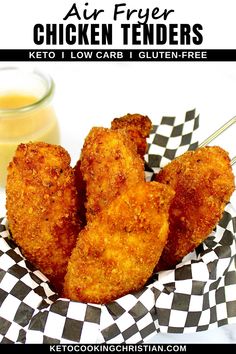 fried chicken tenders in a basket next to a jar of mustard