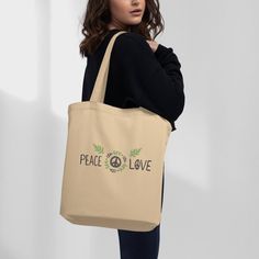 This aesthetic shoulder bag is made of strong, organic fabric and looks great. It has two straps that make it easy to carry, and it can be used as a cool purse, canvas lunch bag, and a canvas makeup bag. You can take it with you when you go to work, school, or even when you have a picnic in the park. It's perfect for a day at the beach too! You can put your towel, sunscreen, sunglasses, and a book inside.   It makes a fantastic book lover gift or can be used as a knitting bag.  The best part is that this bag is good for the environment. Instead of using plastic bags that we throw away, this bag can be used over and over again. It's made from organic cotton, which means it's grown without bad chemicals. Farmers use natural things to help the cotton grow and keep bugs away. When you use this Organic Everyday Tote Bag, Everyday Organic Tote Bag, Everyday Organic Rectangular Bag, Organic Tote Bag For Daily Use, Beige Eco-friendly Tote Canvas Bag, Organic Tote Bag For Everyday, Eco-friendly Canvas Shoulder Bag, Everyday Beige Canvas Bag With Eco-friendly Ink, Organic Tote Bag