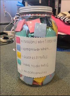 a jar filled with lots of sticky notes