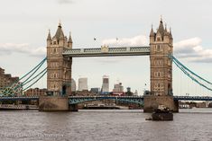 the tower bridge is very tall and has many spires on it's sides